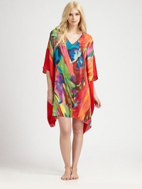 Vivid colors swirl on this flowing animal-inspired design of silky-smooth material. V-neckThree-quarter length dolman sleevesAbout 36 from shoulder to hemPolyesterMachine washImported