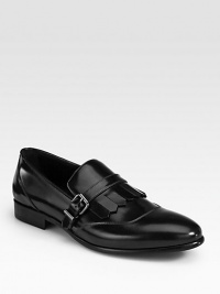 EXCLUSIVELY AT SAKS. Classic loafer with buckle and fringe detail, impeccably crafted in Italy from smooth spazolato leather.Leather upperLeather liningLeather soleMade in Italy