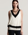 A layered Sweet Pea top boasts must-have color blocking, standing out in black and white for sharp, graphic style.