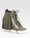 Vintage-inspired fringe adds movement to this suede sneaker with edgy zipper details, lifted by a hidden wedge and rubber platform. Hidden wedge, 3½ (90mm)Rubber platform, 1 (25mm)Compares to a 2½ heel (65mm)Suede upperSide zippers and back zipLeather liningRubber solePadded insoleMade in Italy