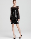 Graduated paillettes work their way down a fitted BCBGMAXAZRIA dress--long sleeves make this dazzling creation a perfect cool weather party choice.