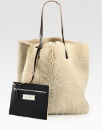 Super-soft and so luxurious, this shearling style comes with a detachable coin pouch for easy access to your smaller essentials.Double leather shoulder straps, 10 dropOpen topDetachable coin pouch13W X 15¾H X 6DMade in Italy