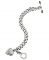 Juicy Couture's lovely bracelet gets your heart racing with a banner heart charm embellished with pave accents. Complete with a toggle closure. Chain crafted in silver tone stainless steel. Charms crafted in silver tone mixed metal. Approximate length: 7 inches. Approximate drop: 1 inch.