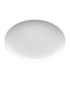 With subtle concentric rings and a sleek shape in durable porcelain, Rosenthal's Loft oval platter brings chic versatility to modern tables.