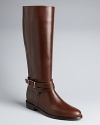 Burberry has the equestrian look mastered, as these superb riding boots illustrate. Bridal polished leather, gleaming hardware and harness straps wrap up the design.