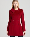 Stand out in the snow with Elie Tahari's rich red Drew coat, crafted with shining silver snaps for a modern look.