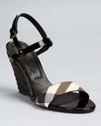 A sleek black raffia wedge supports a check-printed and patent espadrille sandal from Burberry.