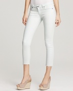 These light-wash Paige Denim skinny jeans boast frayed and cropped hems-better to show off the season's favorite footwear.