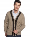 Get sophisticated, standout style in this Geoffrey Beene cardigan sweater with contrast detail.