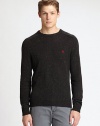 Classic crewneck sweater is impeccably knitted in a rich wool and cotton blend with contrasting donegal details, accented with an embroidered penguin detail at the chest.CrewneckRibbed knit collar, cuffs and hemWool/cotton/acrylicDry cleanImported