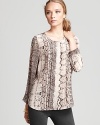 Animal prints remain an on-going trend for fall as seen here with our new Joie top, enriched by a beguiling snake print.