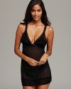 Sparkle and shine in the boudoir with OnGossamer's sheer, velvet-flocked chemise with a back keyhole and side slits.