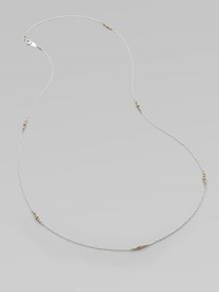 A graceful sterling silver chain, delicately spaced with clusters of tiny, faceted 14k gold beads.14k yellow gold and sterling silverLength, about 26Spring ring claspMade in USA