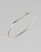 From the Bangle Collection. A single bangle of sterling silver, smooth on the outside and cabled on the inside, to wear alone or with others. Sterling silver Width, about ¼ Diameter, about 2½ Imported 