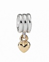 A 14K gold heart dangles from a shiny sterling silver ring. Charm by PANDORA.