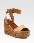 '70s-inspired classic with an adjustable ankle strap and modern laser-cut wedge. Laser-cut leather wedge, 4 (100mm)Laser-cut leather platform, 1½ (40mm)Compares to a 2½ heel (65mm)Leather upperLeather liningRubber solePadded insoleImported