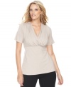 An essential component for any wardrobe, INC's classic plus size surplice top features flattering ruched sides for a feminine, soft look. (Clearance)