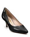 A pointed toe adds to the timeless style of these patent leather kitten heels.