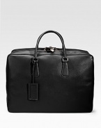 An elegant travel tote in saffiano leather with a full-zip closure and straps inside. Zip closure Top handles ID tag 20W X 14H X 7D Made in Italy 