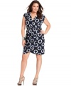 Impress from day to night with MICHAEL Michael Kors' cap sleeve plus size dress, featuring a slenderizing faux wrap design.