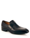 A handsome leather loafer with side gore closure, slightly stacked heel and Bally logo embossed at the upper and sole.