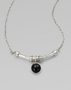 A single, glossy dome of black agate on a curved bar and a link chain. SilvertoneBlack agateLength, about 18Pendant size, about ½Lobster clasp closureMade in USA