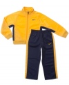 Suit him up for the day's activities in this sporty track jacket and pant set from Nike.