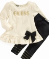 Ruffle, bows and sparkly print give this Guess tunic and leggings set a glam look she will love.