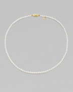 A single strand of luminous pearls with signature clasp closure.4mm white cultured pearls 18K yellow gold Length, about 16 Minuette clasp closure Imported 