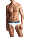 Body defining fit in stretch cotton modal hip briefs. Comfort of cotton with the softness of modal seamlessly blend. Flat lock closures for comfort against the body. Thin large logo waistband in black and blue with X sewn patch.