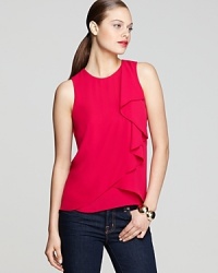 This vividly hued BCBGMAXAZRIA tank flaunts a flouncy ruffled front and striking vented back hem to statement-making effect.