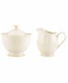 With fanciful beading and a feminine edge, this Lenox French Perle sugar and creamer set is a great addition to your white dinnerware and has an irresistibly old-fashioned sensibility. Hard-wearing stoneware is dishwasher safe and, in a soft white hue with antiqued trim, a graceful addition to any meal.