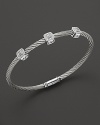 From the Classique Collection, a stackable bangle in white gold and stainless steel with diamond stations. Designed by Charriol.