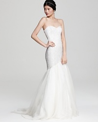 A bodice of sparkling sequins tops off a wispy chiffon skirt on this enchanting Theia mermaid gown.