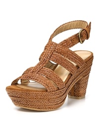 Waving weaves lend cultured style to Stuart Weitzman's Weaveit sandals, finished in a walkable heel balanced out by a thick platform.