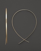 An inverted hoop earring in 14 Kt. gold, with thread-through closure. Designed by Lana.