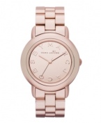 Cozy up to rosy perfection. Watch by Marc by Marc Jacobs crafted of rose-gold ion-plated stainless steel bracelet and round case. Rose-gold tone mirrored dial features logo letters at markers and three hands. Quartz movement. Water resistant to 50 meters. Two-year limited warranty.