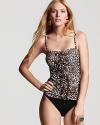 Take the leopard print trend poolside with Profile's spot-splashed tankini. With ruffled detailing, this suit is cabana chic with a solid cover-up and cat-eye frames.