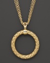 Multiple chains flank an intricately woven yellow silver pendant from Fifth Season by Roberto Coin.