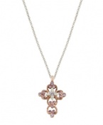 Express your faith with subtle, feminine flair. Vatican pendant features an intricate, scrolling cross highlighted with beautiful violet crystals. Setting and chain crafted in silver tone and rose gold tone mixed metal. Approximate length: 24 inches. Approximate drop: 1-1/4 inches.