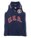 A red, white and blue design with U.S.A. patching and embroidered emblems gives a preppy, all-American look to the classic sleeveless polo, celebrating Team USA's participation in the 2012 Olympics.