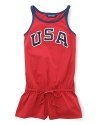 A red, white and blue design with U.S.A. patching gives a preppy, all-American look to a pretty warm-weather romper in celebration of Team USA's participation in the 2012 Olympics.