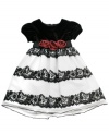 Your little princess will feel like a true grown-up in this beautiful velvet floral dress by Rare Editions.