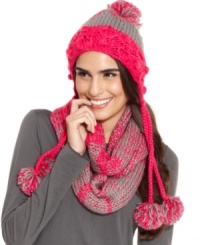 Cozy comfort accented with playful pom poms. Beat the chill in colorful style with this care-free knit cap by American Rag.