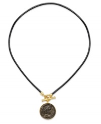 Ancient style from Lauren Ralph Lauren. This toggle necklace features a silver tone Roman coin strung from a genuine leather cord. Crafted in 14k gold plated mixed metal. Approximate length: 18 inches. Approximate drop: 1-1/4 inches.