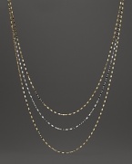 Delicate twisted chains of 14K white and yellow gold.