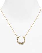 Catch good luck in this glittering 18 Kt. gold plate horseshoe, encrusted with starry Swarovski crystals. By Alexis Bittar.