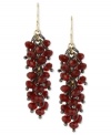 Beads band together to stunning effect in this pair of earrings from Kenneth Cole New York. Crafted from gold-tone mixed metal, the earrings are adorned with a number of red faceted accents. Approximate drop: 1-9/10 inches.