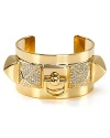 Rock a heavy metal: this Juicy Couture cuff works an edgy vibe, cast in plated metal with chunky stone accents.