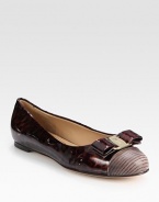 Luminous patent leather flat fronted by a logoed bow and exotic, textured leather toecap. Patent leather and printed leather upperLeather lining and solePadded insoleMade in Italy